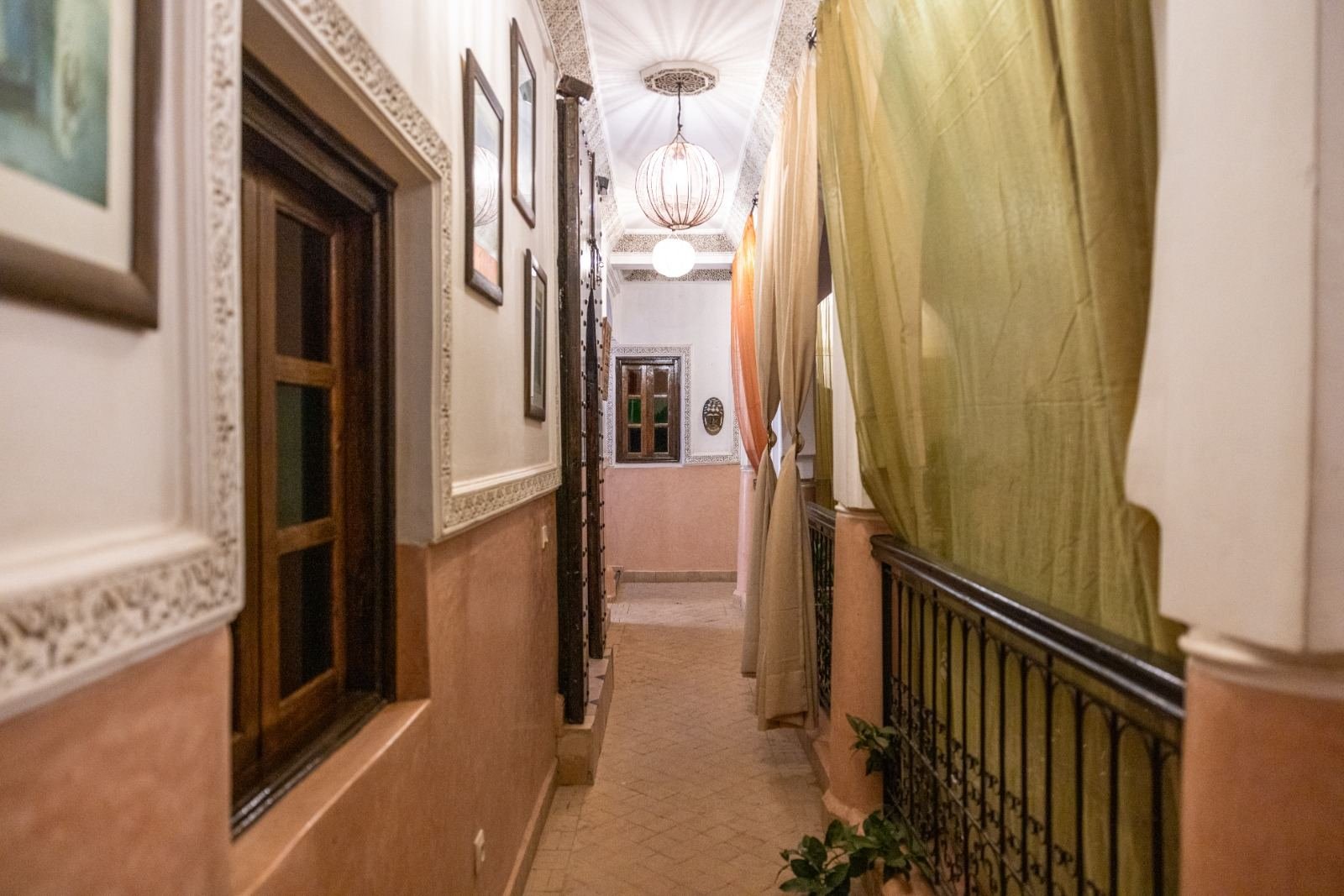 Corridor with Moroccan lanterns at Riad Davina by night